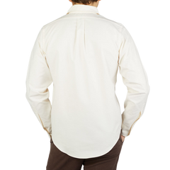 The back view of a man wearing a Far East Manufacturing Ecru Beige Cotton Oxford BD Regular Shirt.