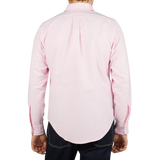 The back view of a man wearing a Pink Cotton Oxford BD Regular Shirt made by Far East Manufacturing.
