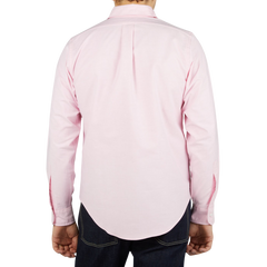 The back view of a man wearing a Pink Cotton Oxford BD Regular Shirt made by Far East Manufacturing.