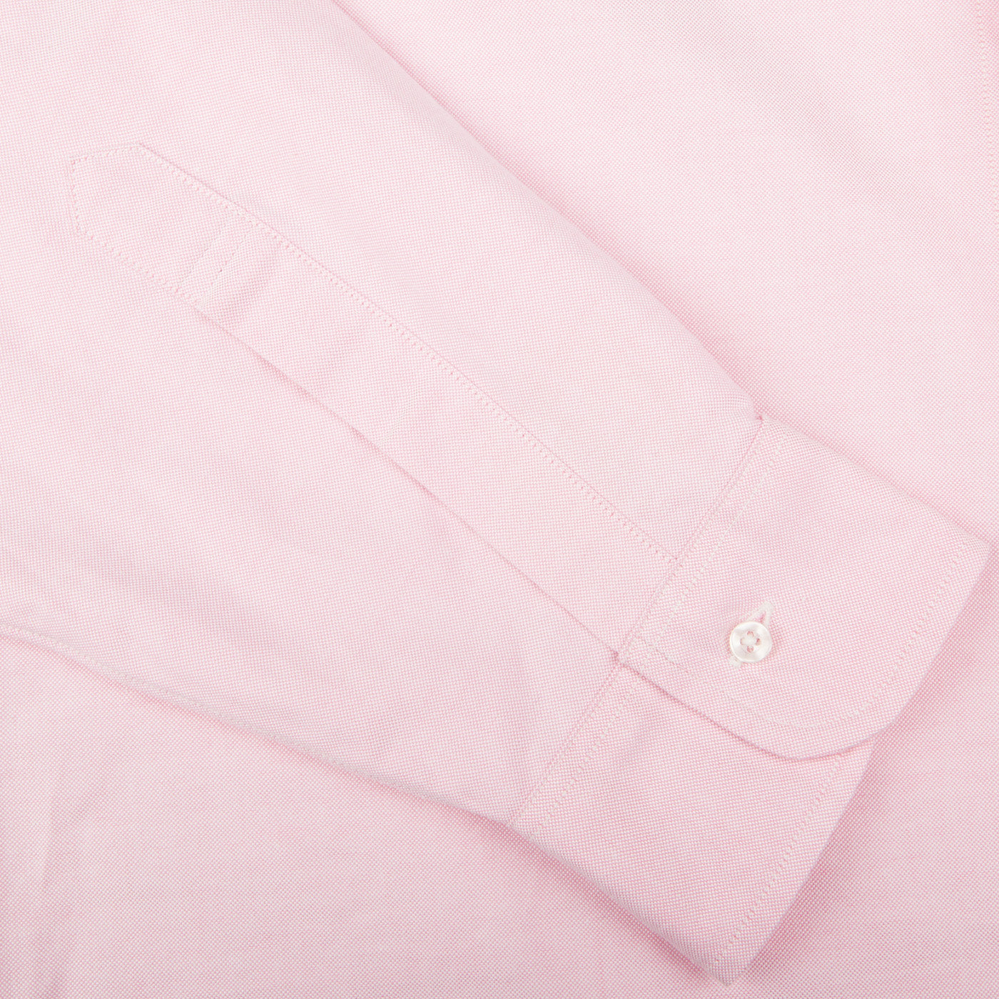 A close up of a Pink Cotton Oxford BD Regular Shirt by Far East Manufacturing on a white surface.