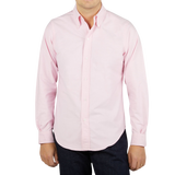 A man wearing a Far East Manufacturing Pink Cotton Oxford BD Regular Shirt.