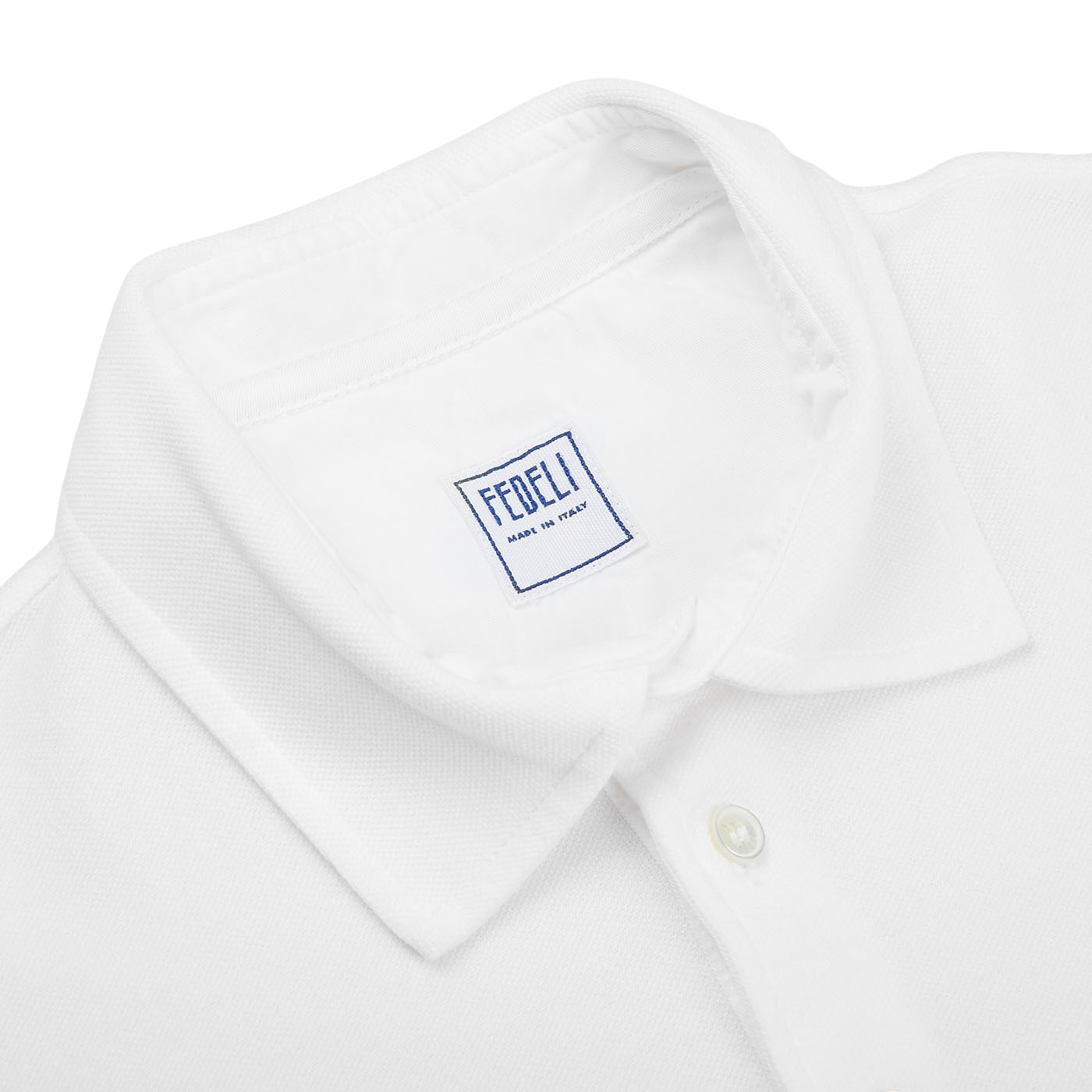 A Fedeli washed white cotton pique polo shirt for the summer wardrobe.