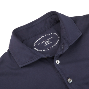 The collar of a Navy Blue Organic Cotton LS Polo Shirt by Fedeli.