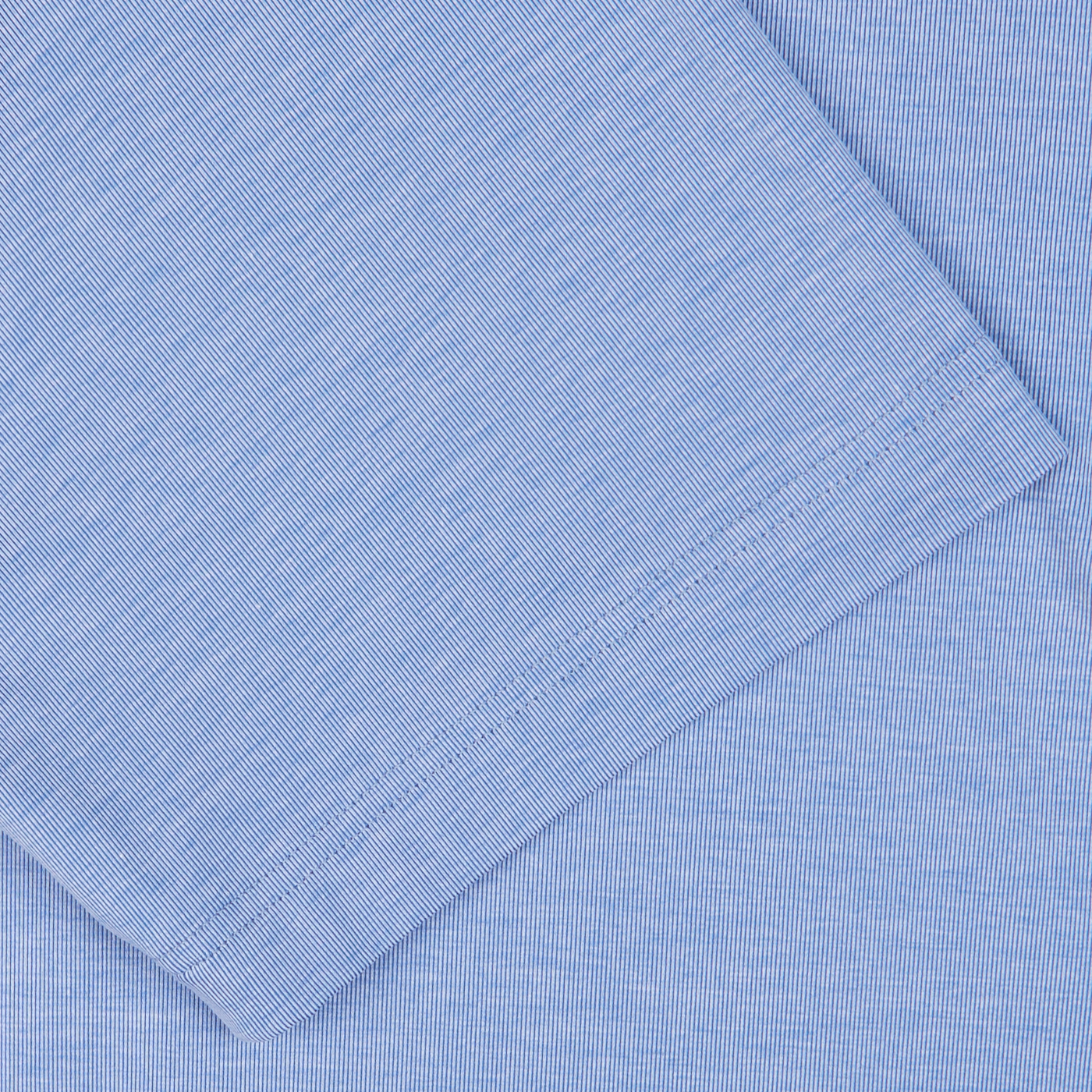 Close-up of Fedeli's Blue Fil-a-Fil Cotton Jersey Polo Shirt with a diagonal weave pattern.