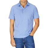 Man wearing a slim fit, Fedeli Blue Fil-a-Fil Cotton Jersey Polo Shirt and jeans.