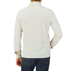 The back view of a man wearing a luxurious Cream Beige Organic Cotton LS Polo Shirt made by Fedeli.