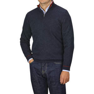 A person is wearing a Dark Blue Wool Cashmere 1/4 Zip Sweater from Fedeli over a light blue collared shirt with dark jeans.