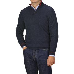 A person is wearing a Dark Blue Wool Cashmere 1/4 Zip Sweater from Fedeli over a light blue collared shirt with dark jeans.