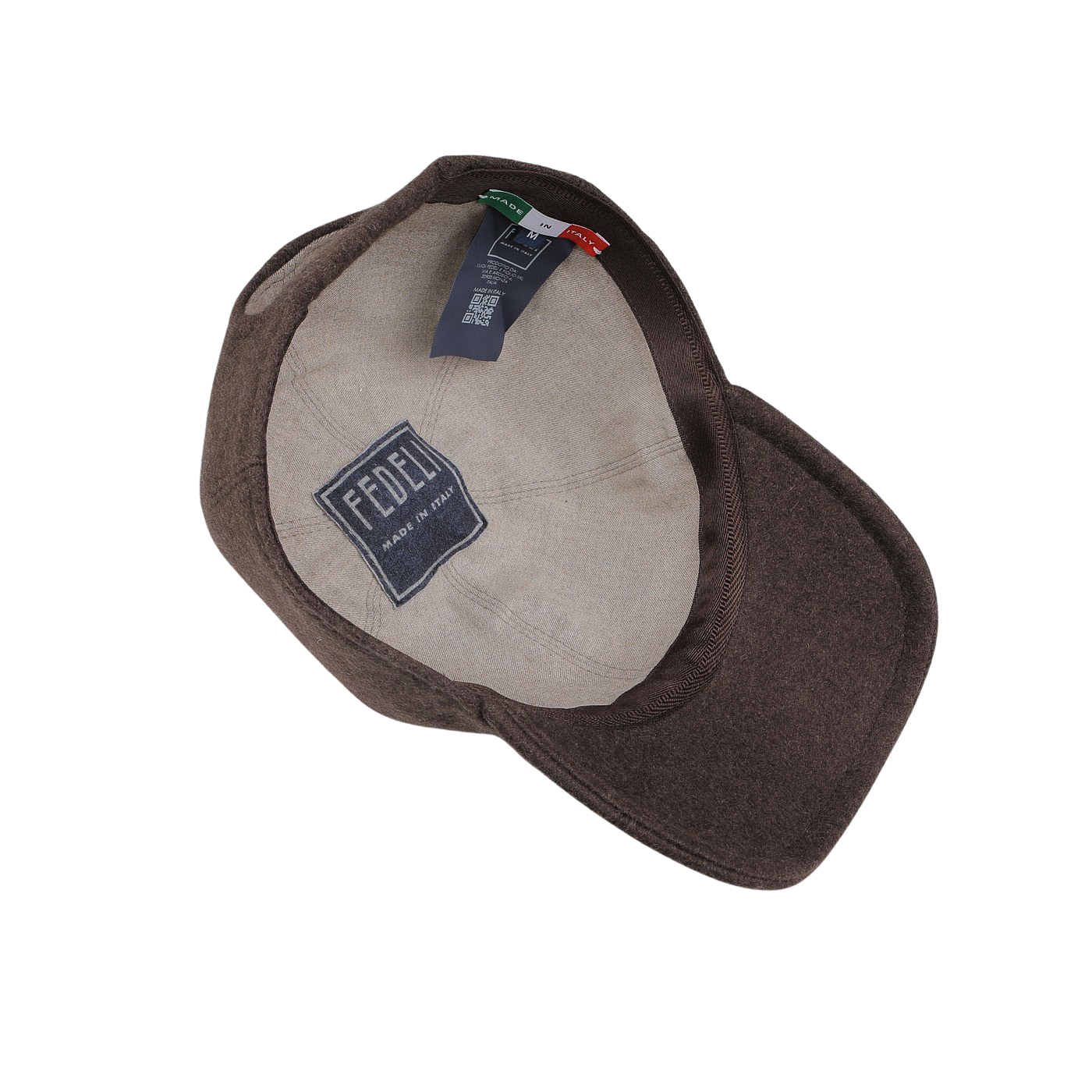 Product Description: This dark brown felted cashmere cap by Fedeli features a beige inner lining and a stitched label that reads "Fedeli Made in Italy." It also includes two tags indicating product details and materials. As part of the Storm System collection, this stylish cap offers added weather resistance.