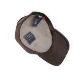 Product Description: This dark brown felted cashmere cap by Fedeli features a beige inner lining and a stitched label that reads "Fedeli Made in Italy." It also includes two tags indicating product details and materials. As part of the Storm System collection, this stylish cap offers added weather resistance.