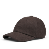 The Fedeli Dark Brown Felted Cashmere Cap features a curved brim and a button on top, crafted from textured felted cashmere.