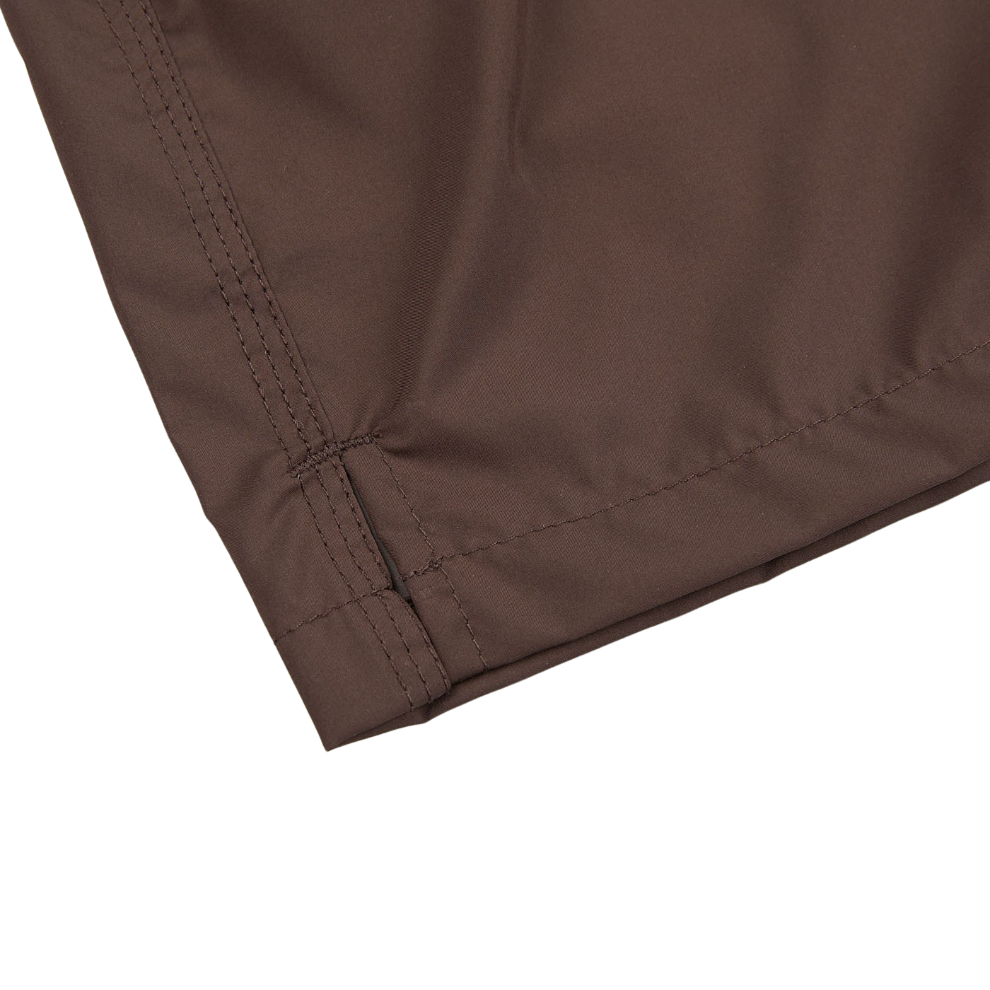 A close up of Fedeli Dark Brown Microfiber Madeira Swim Shorts, a luxury casual wear, on a white surface.