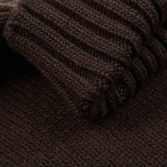 A close-up of the Fedeli Dark Brown Wool Cashmere Rollneck highlights its ribbed cuffs and elegant design.