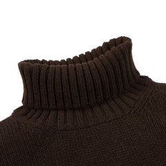 The Fedeli Dark Brown Wool Cashmere Rollneck features a luxurious ribbed roll neck. Photographed against a plain white background, this piece exemplifies the elegance of Italian knitwear.