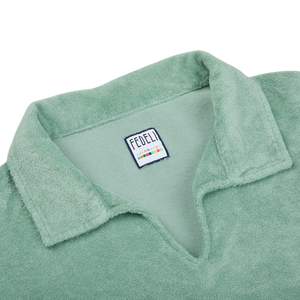 A long-sleeve flannel shirt in a favorite shade of green, with a Fedeli label on the collar.