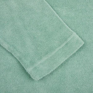 A close up of a Fedeli Light Green Cotton Toweling Shirt, perfect for summer.