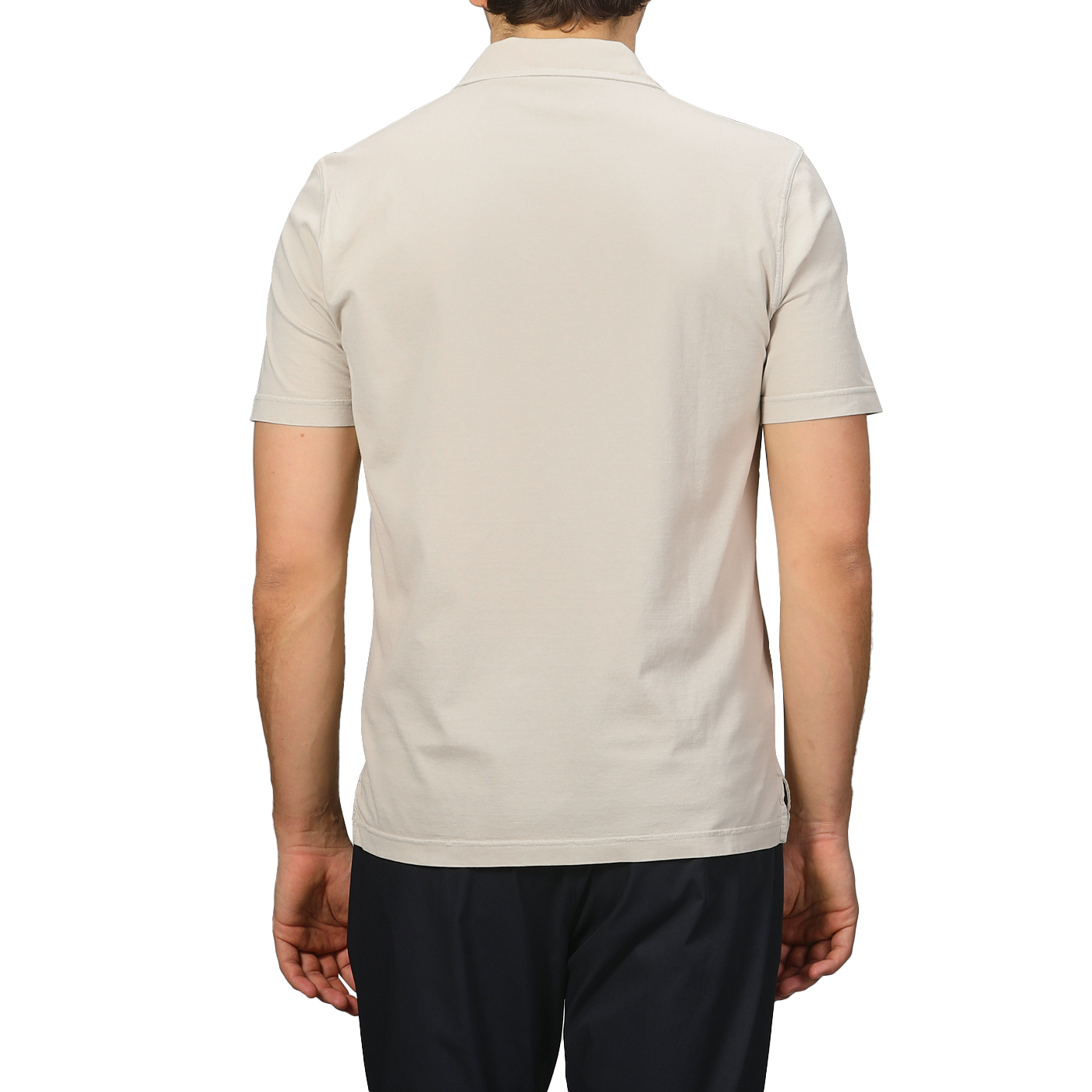 A person wearing a Fedeli Light Beige Organic Cotton Capri Collar Polo Shirt is paired with black pants, standing against a gray background.