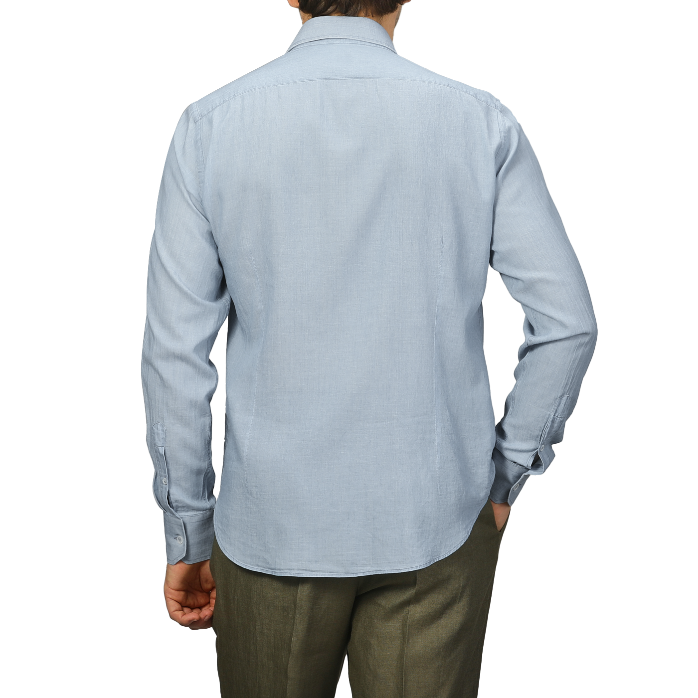 A person wears a Fedeli light blue cotton denim shirt and gray pants, seen from the back against a plain background.