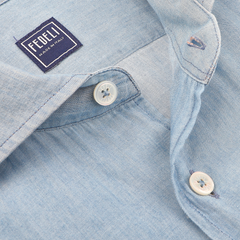 Close-up of a Light Blue Cotton Denim Shirt by Fedeli, featuring white buttons and a "Fedeli Made in Italy" label.