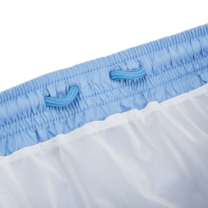 A close up of Fedeli's Light Blue Microfiber Madeira Swim Shorts with mesh lining.