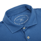 The collar of a Light Blue Organic Cotton LS Polo Shirt by Fedeli.