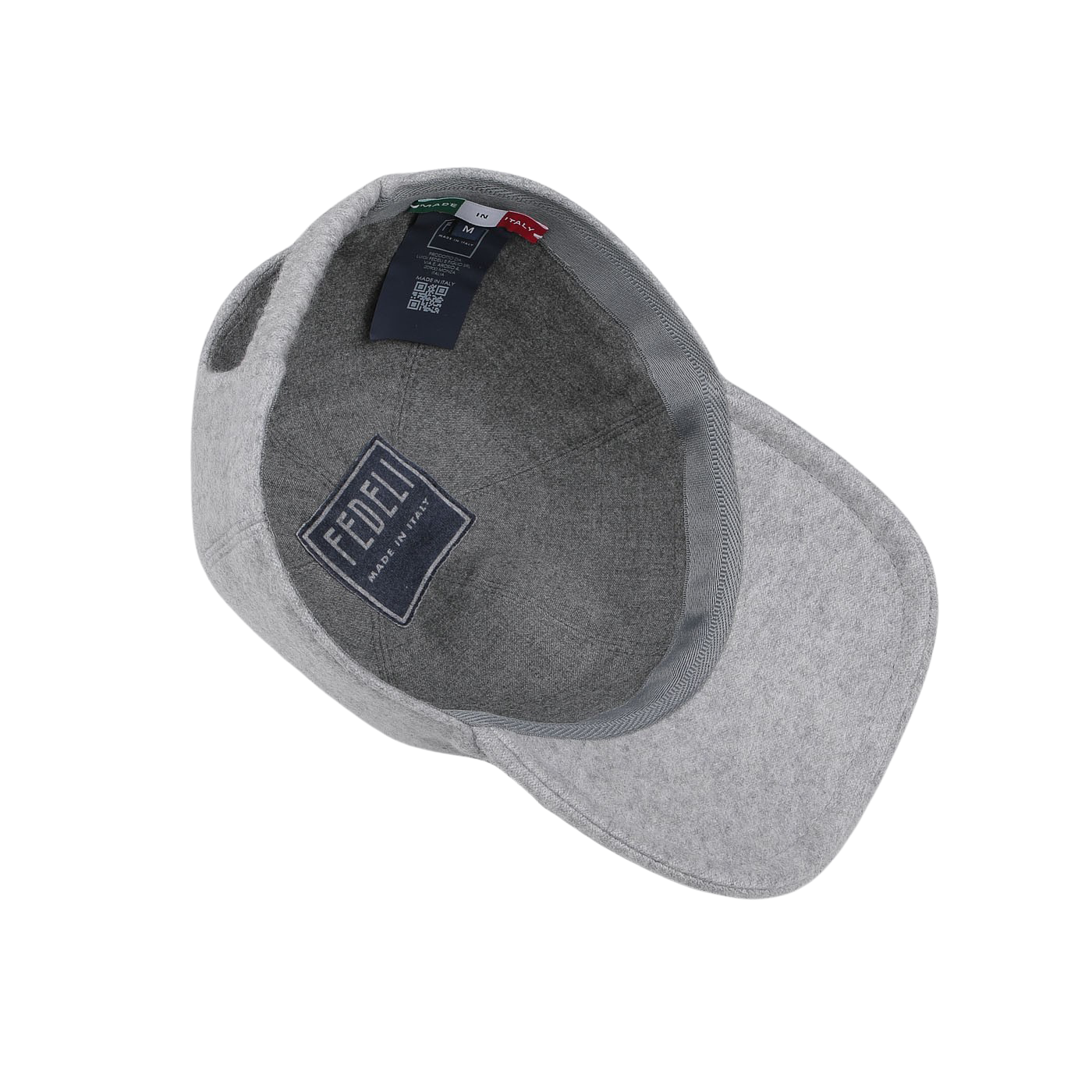 A Light Grey Felted Cashmere Cap from Fedeli is shown from the inside, revealing labels and tags, including a blue label with the brand name "FEDELI," which highlights its luxurious material.