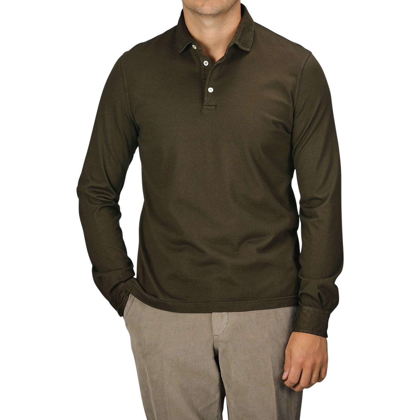 A person wearing a Fedeli Moss Green Organic Cotton LS Polo Shirt and beige pants, standing with one hand in their pocket against a plain background, exudes luxury casual-wear.