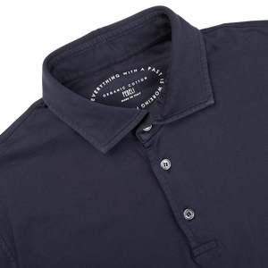A close up of a Navy Blue Organic Cotton Polo Shirt crafted from Giza cotton by Fedeli.