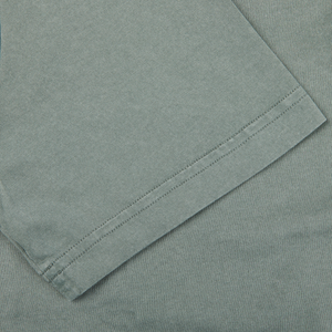 A close up of a Fedeli Olive Green Organic Cotton Polo Shirt.