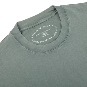 The back of a luxury olive green Giza organic cotton t-shirt with a label on it. (Fedeli)