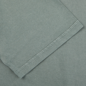 A close up of a luxury Olive Green Giza organic cotton t-shirt by Fedeli.