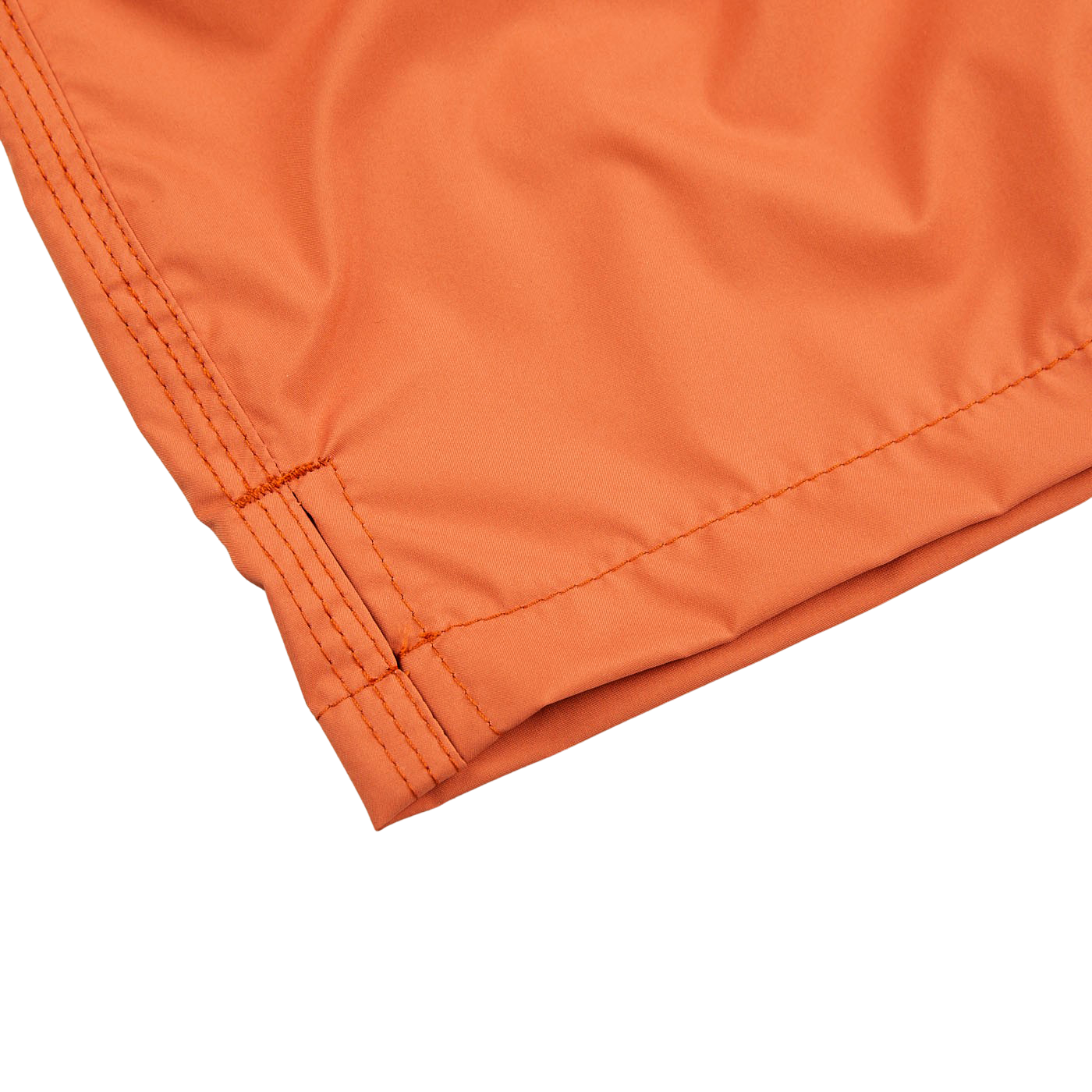A pair of Fedeli Rust Brown Microfiber Madeira Swim Shorts with a mesh lining, placed on a white surface.