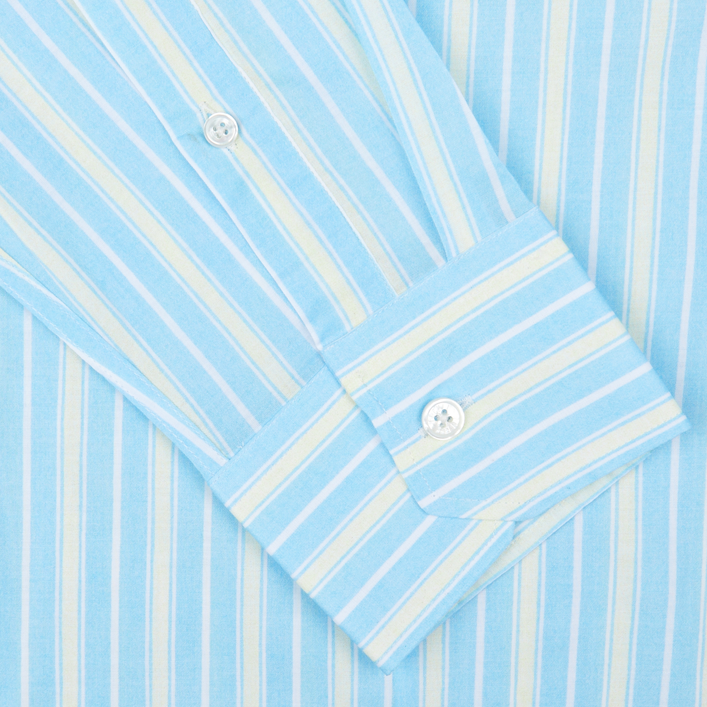 A close-up view of a Fedeli Sky Blue Yellow Striped Cotton Beach Shirt with a focus on the cuff and buttons.