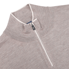 Fedeli's Taupe Beige Cashmere Silk 1/4 Zip Sweater combines luxury with a cozy cashmere-silk blend, featuring a high collar and elegant white piping around the zipper.