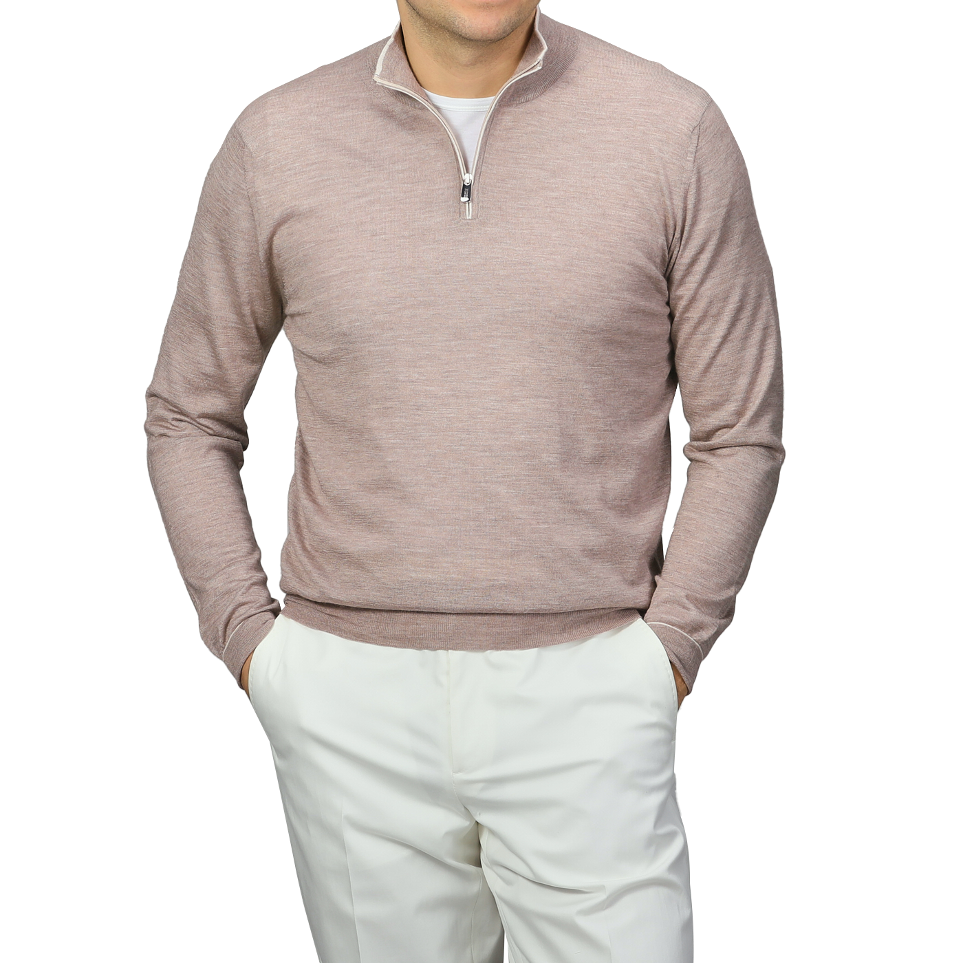 A person in a Fedeli Taupe Beige Cashmere Silk 1/4 Zip Sweater over a white shirt with white pants stands hands-in-pockets against a gray background.