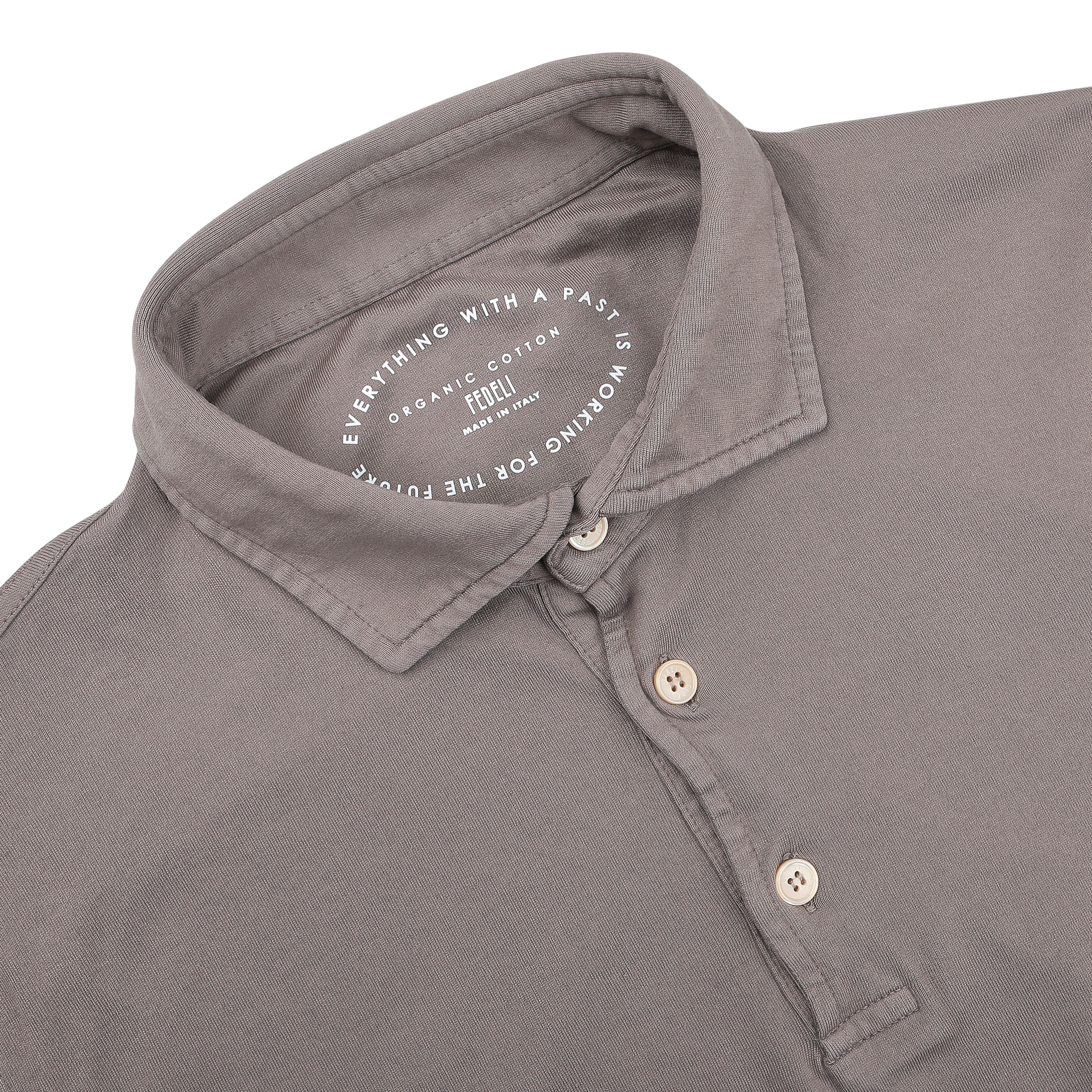 The Fedeli Taupe Beige Organic Cotton LS Polo Shirt is a luxury item with a collar and three buttons, crafted from organic Giza cotton. The inner label reads: "Everything with a past is organic cotton. Recycled for the future.