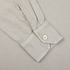 A close up of a Fedeli Taupe Beige Organic Cotton LS Polo Shirt with buttons.