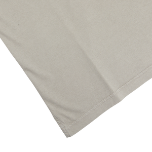 A luxury taupe beige Fedeli organic cotton LS polo shirt on a white surface.
