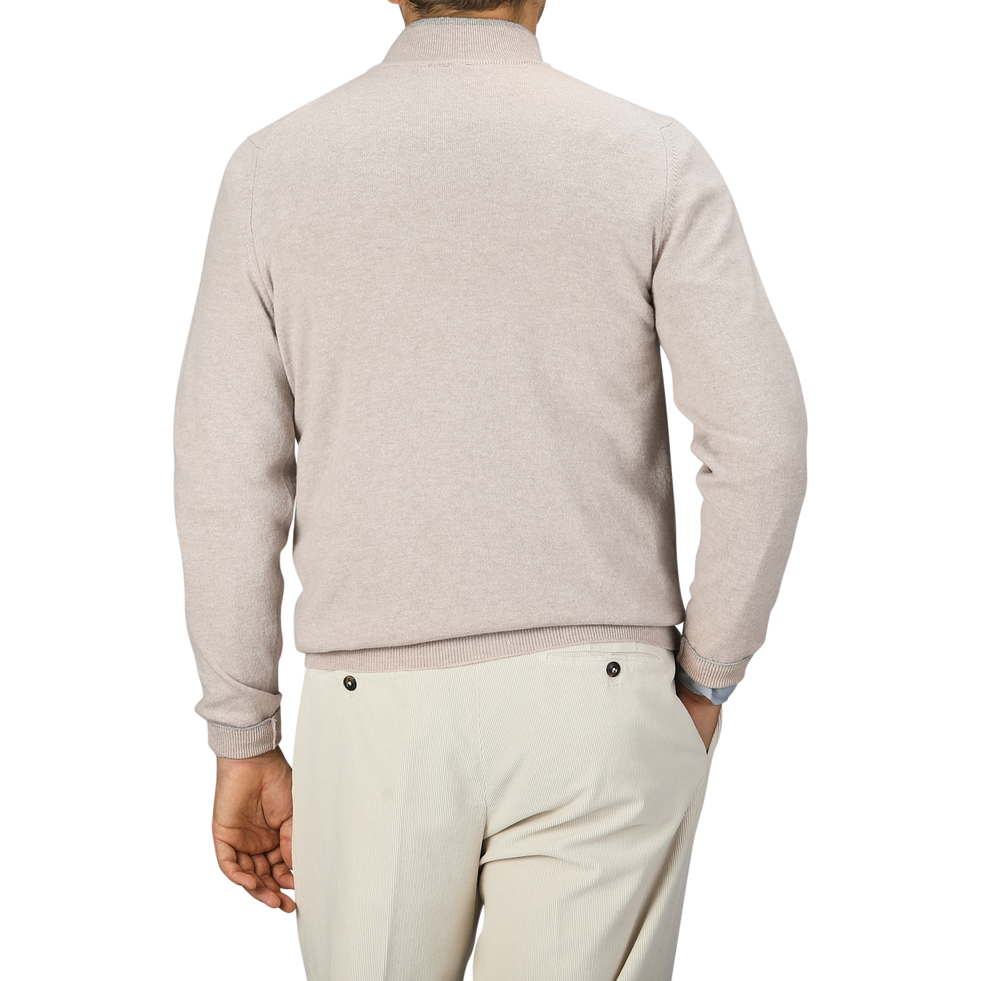 A person wearing a Fedeli Taupe Beige Wool Cashmere 1/4 Zip Sweater and cream-colored pants, viewed from the back.