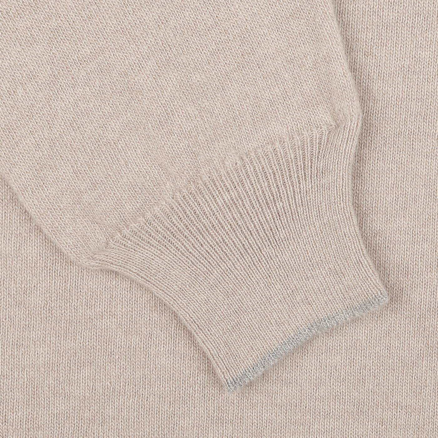 Close-up of the Fedeli Taupe Beige Wool Cashmere 1/4 Zip Sweater sleeve, showcasing the ribbed cuff detail – perfect as a layering piece.