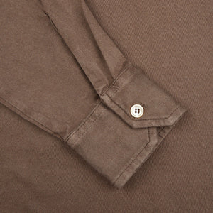 A close up of a Fedeli Washed Brown Organic Cotton LS Polo Shirt.