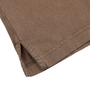A close up of a Fedeli Washed Brown Organic Cotton LS Polo Shirt made from Giza cotton.