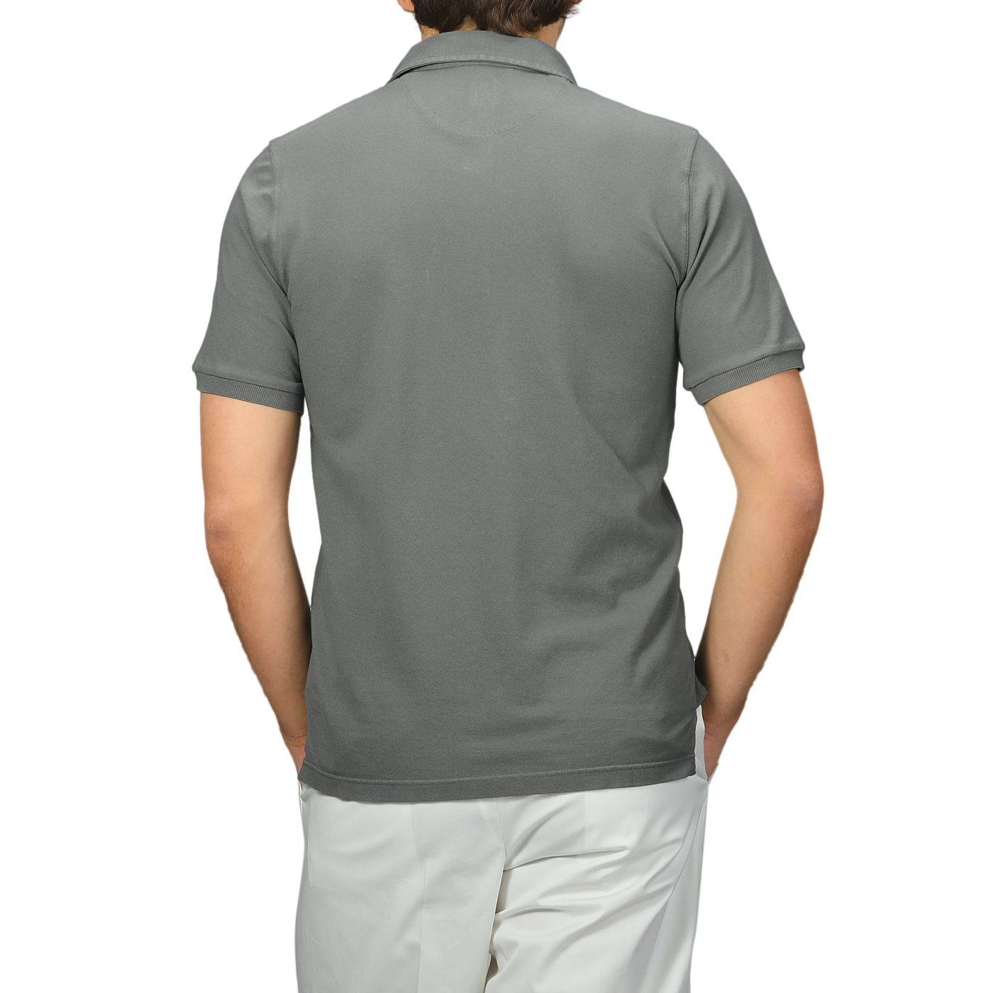 A person is shown from the back in a Fedeli Washed Green Cotton Pique Polo Shirt and white pants against a plain background.