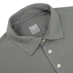 This Washed Green Cotton Pique Polo Shirt exudes superior quality with its collar design. The label "Fedeli Made in Italy" assures timeless craftsmanship and style.