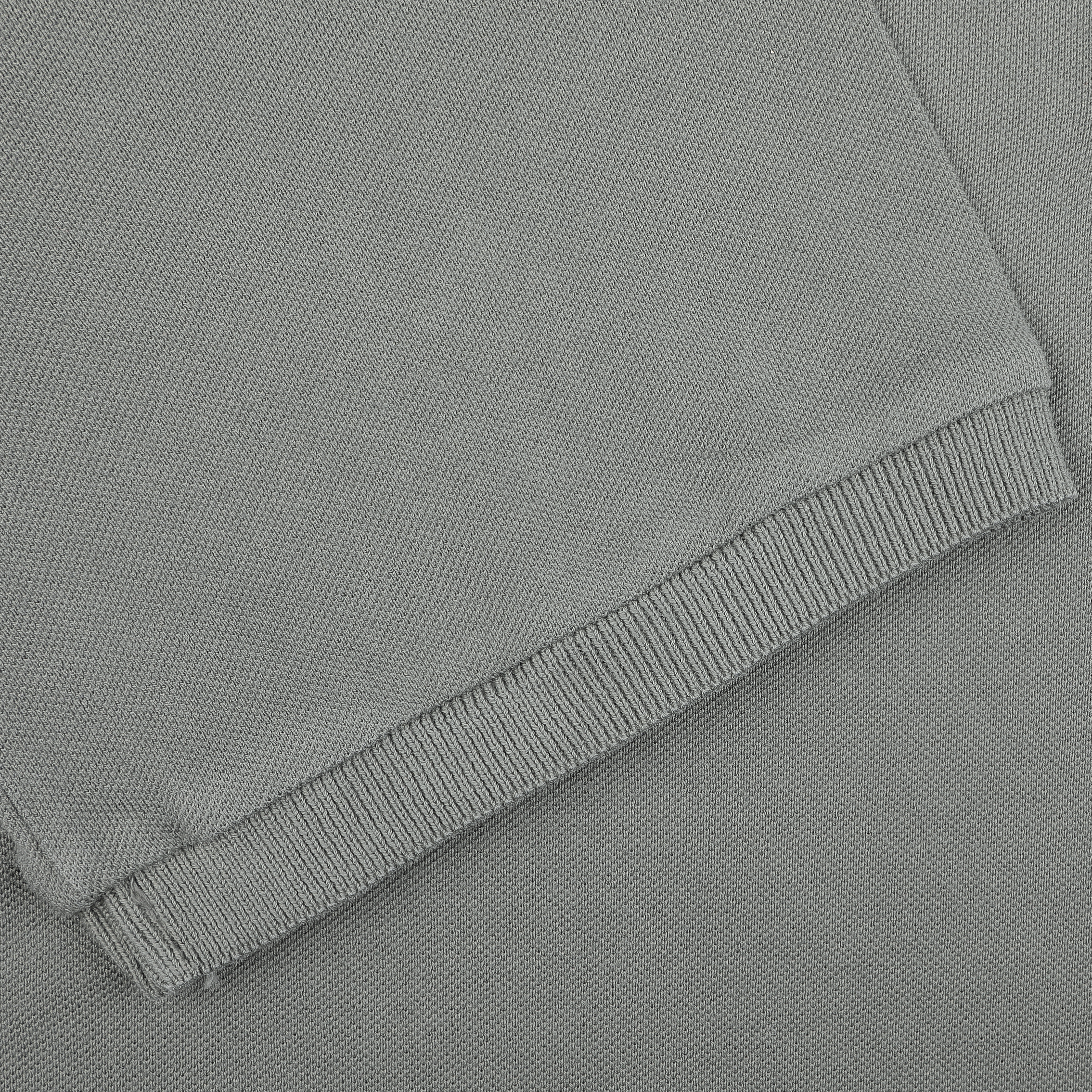 Close-up of the Washed Green Cotton Pique Polo Shirt by Fedeli, highlighting the knit texture and superior stitching details.