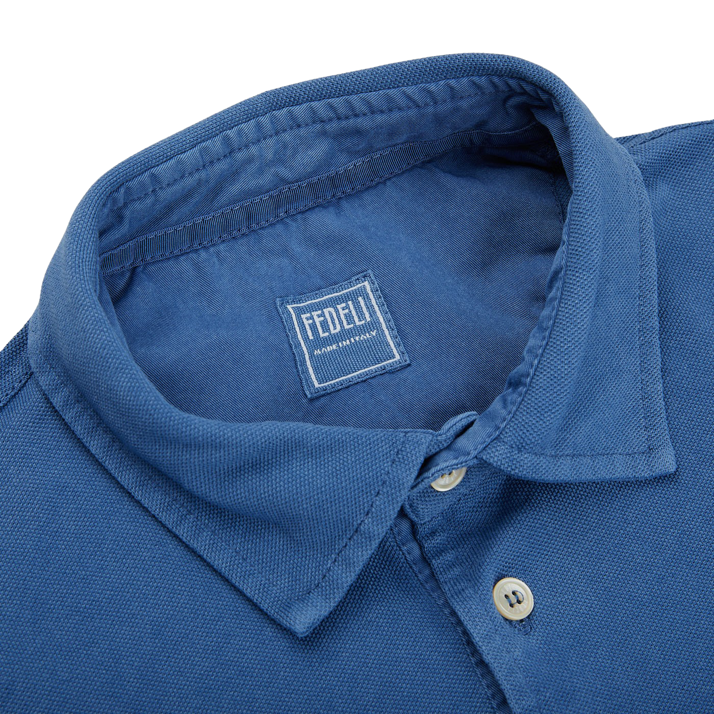 A Fedeli Washed Light Blue Cotton Pique Polo Shirt with a collar.