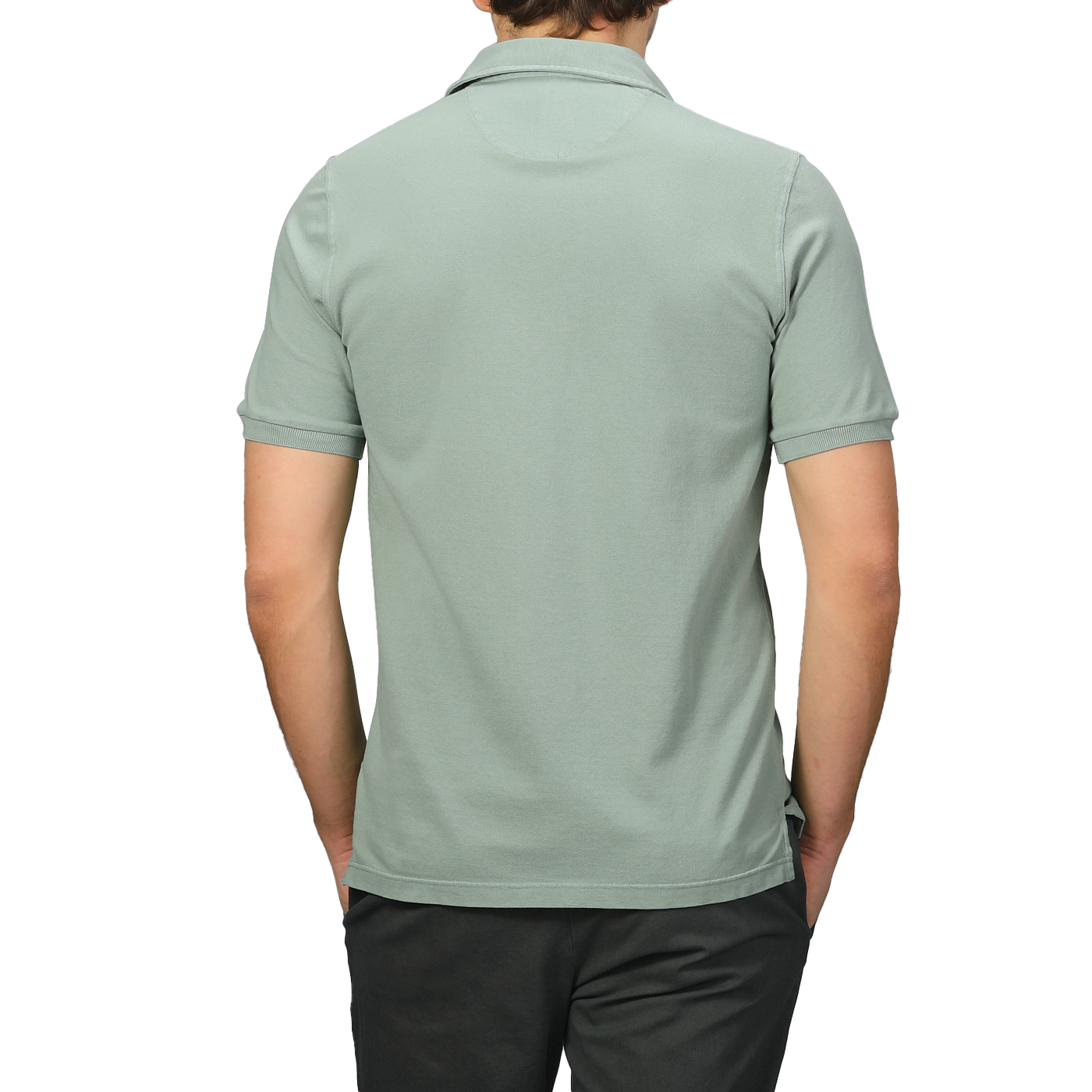 A person wearing a high-quality Fedeli Washed Light Green Cotton Pique Polo Shirt and dark pants is shown from the back against a gray background, ideal for summer attire.