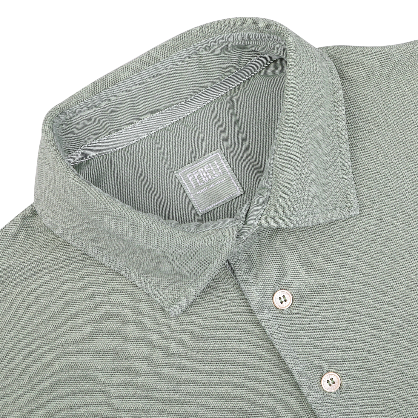 The Washed Light Green Cotton Pique Polo Shirt by Fedeli, labeled "Made in Italy," is crafted from superior quality cotton and makes a perfect addition to your summer wardrobe.