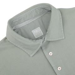 The Washed Light Green Cotton Pique Polo Shirt by Fedeli, labeled "Made in Italy," is crafted from superior quality cotton and makes a perfect addition to your summer wardrobe.