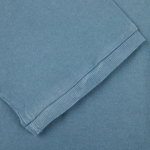 A close up of a Fedeli Washed Turquoise Cotton Pique Polo Shirt.